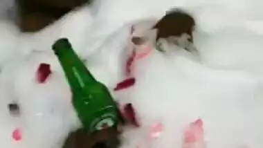 Attractive Desi chick enjoys beer and bubble bath in hot XXX video